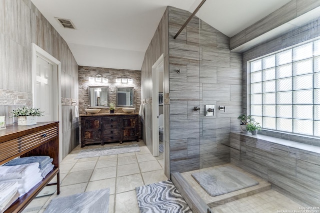 full bath with visible vents, toilet, tiled shower, tile patterned floors, and vanity