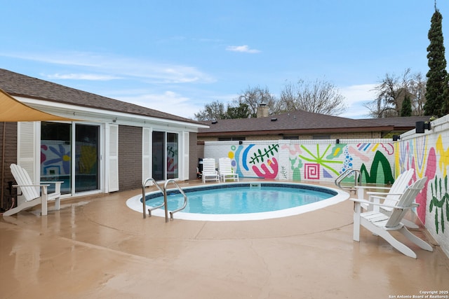 view of pool featuring a fenced in pool and a patio