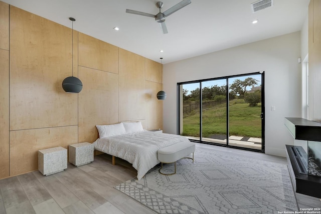 bedroom with recessed lighting, visible vents, light wood-style floors, and access to exterior