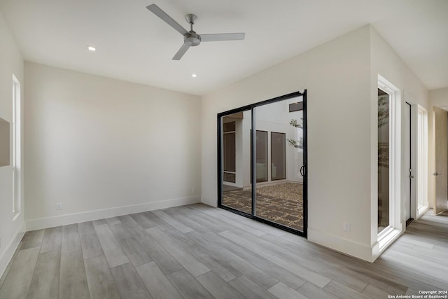 empty room featuring recessed lighting, baseboards, wood finished floors, and a ceiling fan