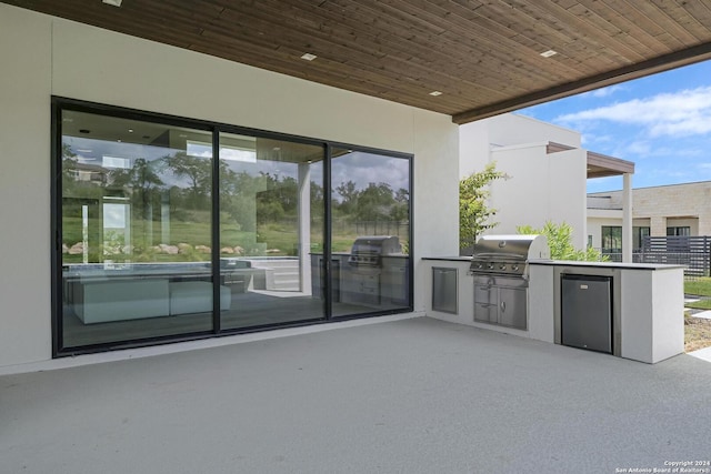 view of patio featuring area for grilling and exterior kitchen