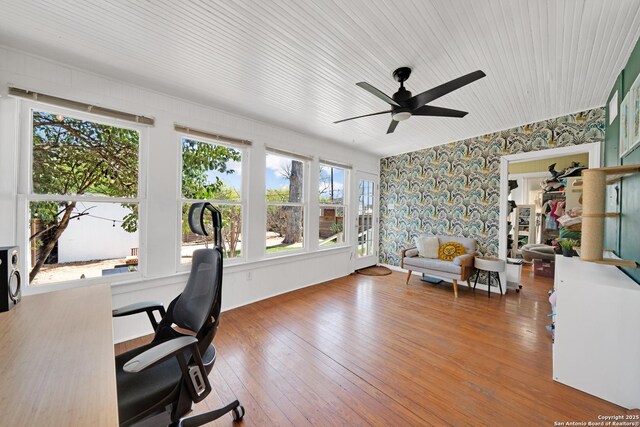 office space featuring ceiling fan, hardwood / wood-style floors, and wallpapered walls