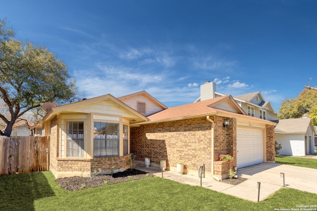 view of front of home featuring a front lawn, fence, concrete driveway, a garage, and brick siding