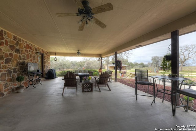 view of patio / terrace with outdoor dining area and ceiling fan