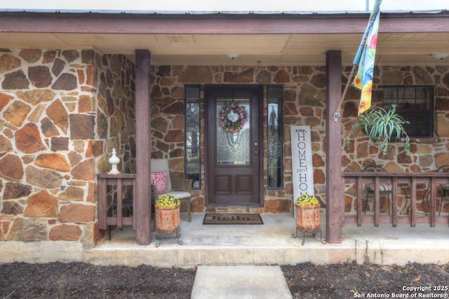 view of exterior entry with stone siding