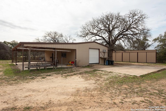 exterior space with dirt driveway