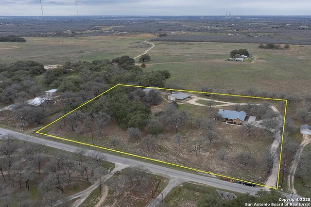 birds eye view of property featuring a rural view