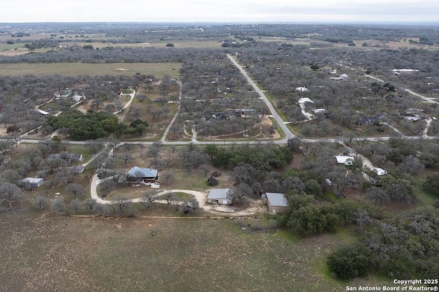 birds eye view of property featuring a rural view