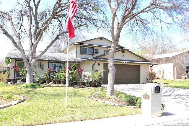 view of front of home featuring decorative driveway, brick siding, and a front yard