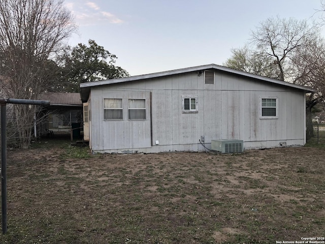 back of property featuring central air condition unit