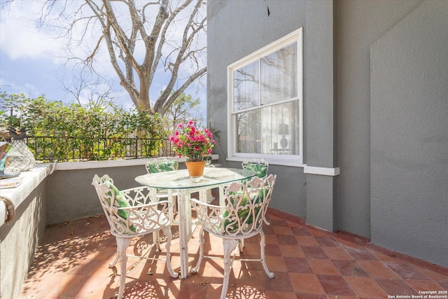 balcony with outdoor dining area