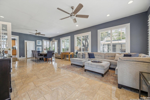 living area featuring plenty of natural light, recessed lighting, and ceiling fan