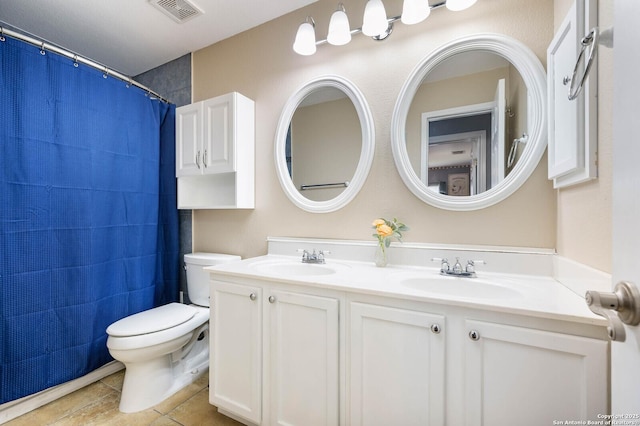 full bathroom featuring double vanity, visible vents, toilet, and a sink