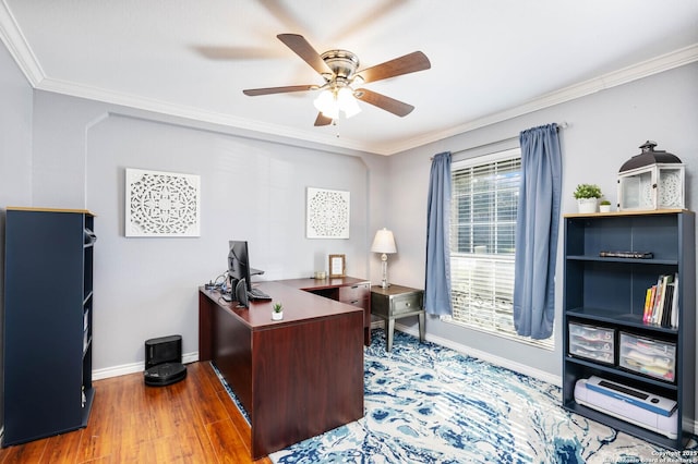 home office featuring a ceiling fan, wood finished floors, baseboards, and ornamental molding