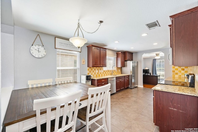 dining space with recessed lighting, visible vents, a wealth of natural light, and ceiling fan