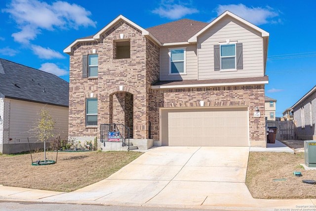 traditional home with brick siding, concrete driveway, and a shingled roof