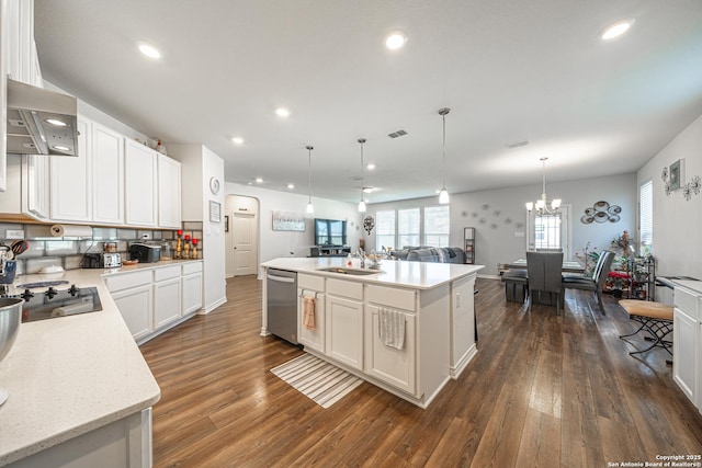 kitchen with a center island, open floor plan, wall chimney exhaust hood, black electric cooktop, and stainless steel dishwasher