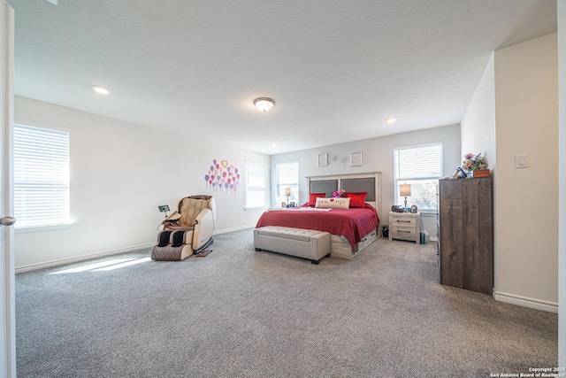 carpeted bedroom featuring multiple windows, recessed lighting, and baseboards