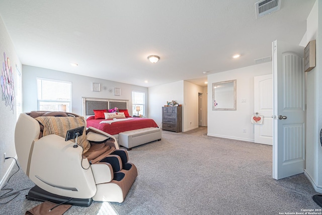 carpeted bedroom with recessed lighting, visible vents, multiple windows, and baseboards