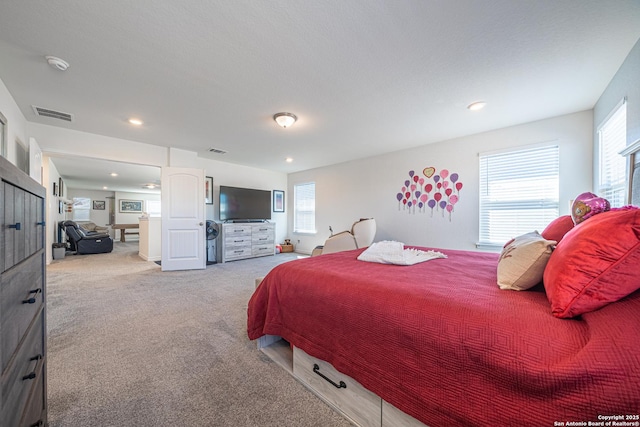 bedroom featuring recessed lighting, visible vents, and light colored carpet