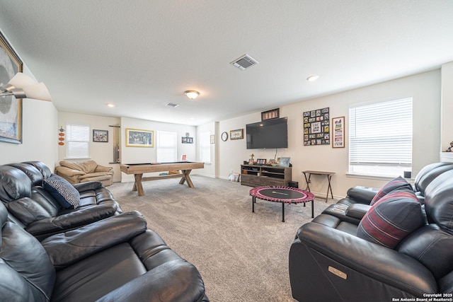 living room featuring pool table, visible vents, carpet floors, and a textured ceiling