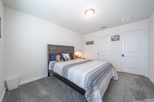 bedroom featuring baseboards, visible vents, and carpet floors