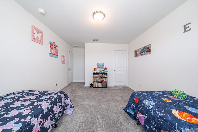 bedroom featuring baseboards, visible vents, and carpet floors