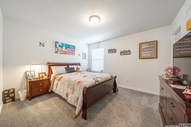 carpeted bedroom featuring baseboards and a textured ceiling