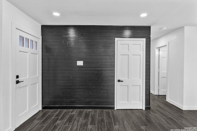 interior space with recessed lighting, baseboards, and wood finish floors