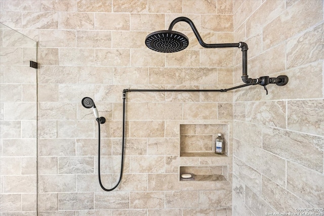 bathroom with a tile shower