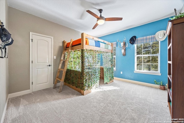 unfurnished bedroom with baseboards, carpet floors, and ceiling fan