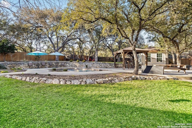 view of yard with a gazebo and fence