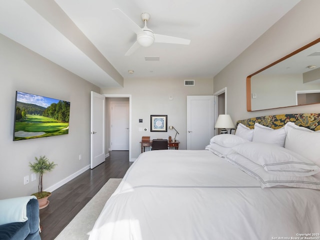 bedroom with ceiling fan, visible vents, baseboards, and dark wood finished floors