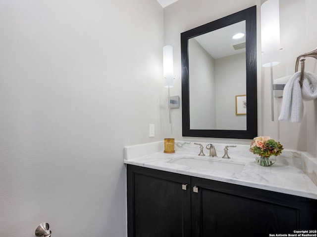 bathroom with visible vents and vanity