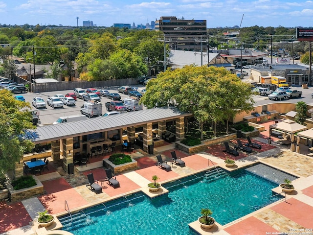 view of swimming pool with a fenced in pool and a patio