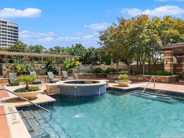 pool featuring a patio area, a pergola, a community hot tub, and fence