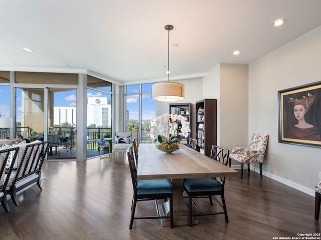 dining space with a wall of windows, baseboards, dark wood finished floors, and recessed lighting