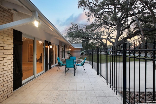 view of patio / terrace featuring fence