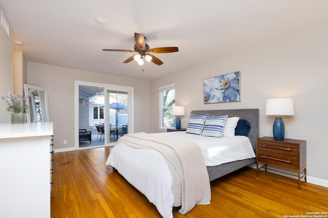 bedroom featuring access to exterior, light wood-style flooring, baseboards, and ceiling fan