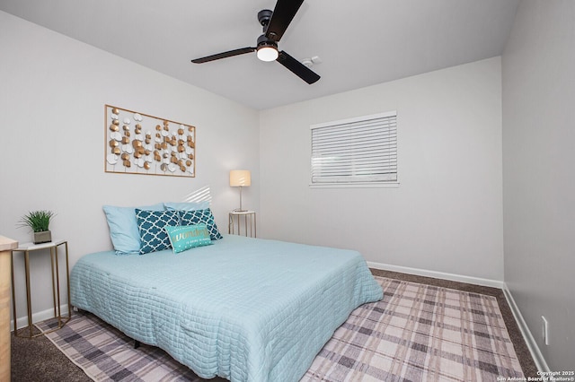 bedroom with carpet, a ceiling fan, and baseboards