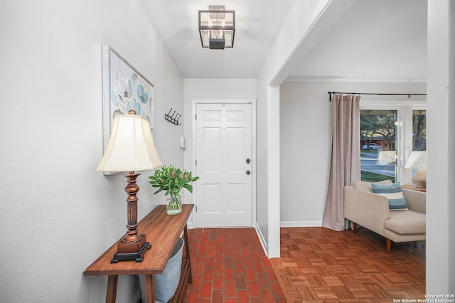 foyer entrance featuring baseboards