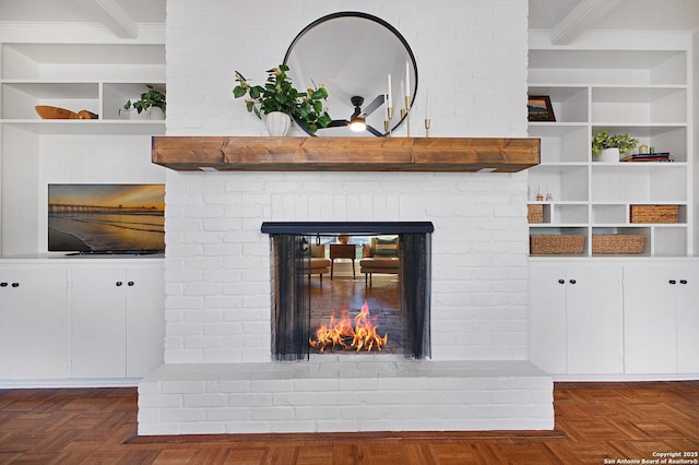 interior details featuring built in features and a brick fireplace