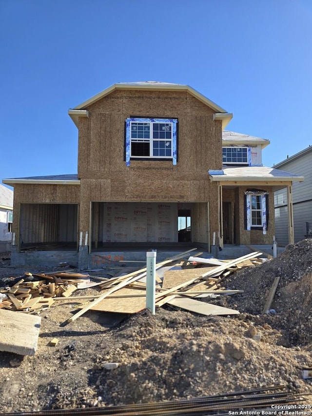 unfinished property with a garage
