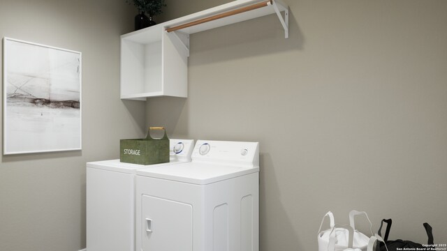 washroom with laundry area and washer and dryer