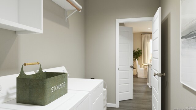 laundry room featuring dark wood finished floors, laundry area, and washer and clothes dryer