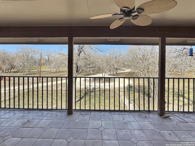 view of patio / terrace featuring a balcony and ceiling fan