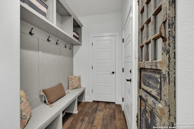 mudroom featuring dark wood-style flooring