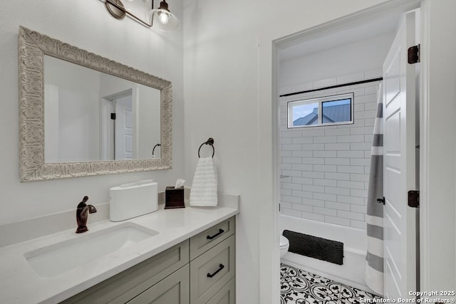 full bath featuring toilet, vanity, and shower / bath combo