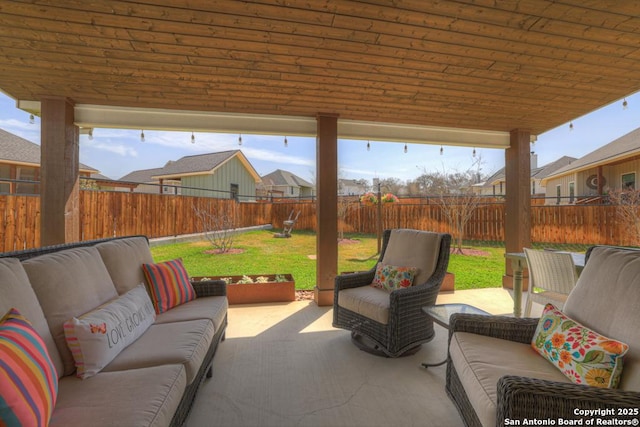 view of patio with an outdoor hangout area and a fenced backyard