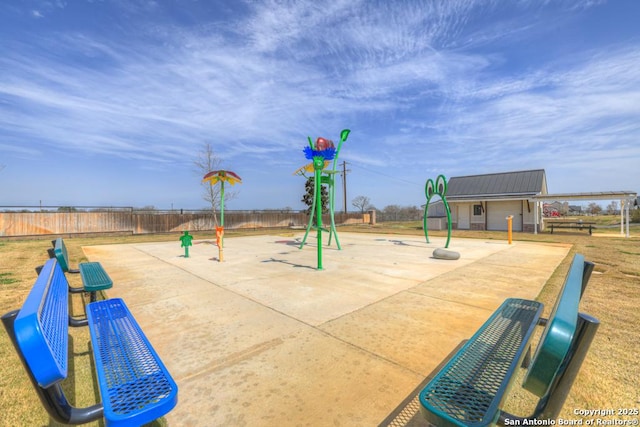 view of jungle gym featuring an outdoor structure and a fenced backyard